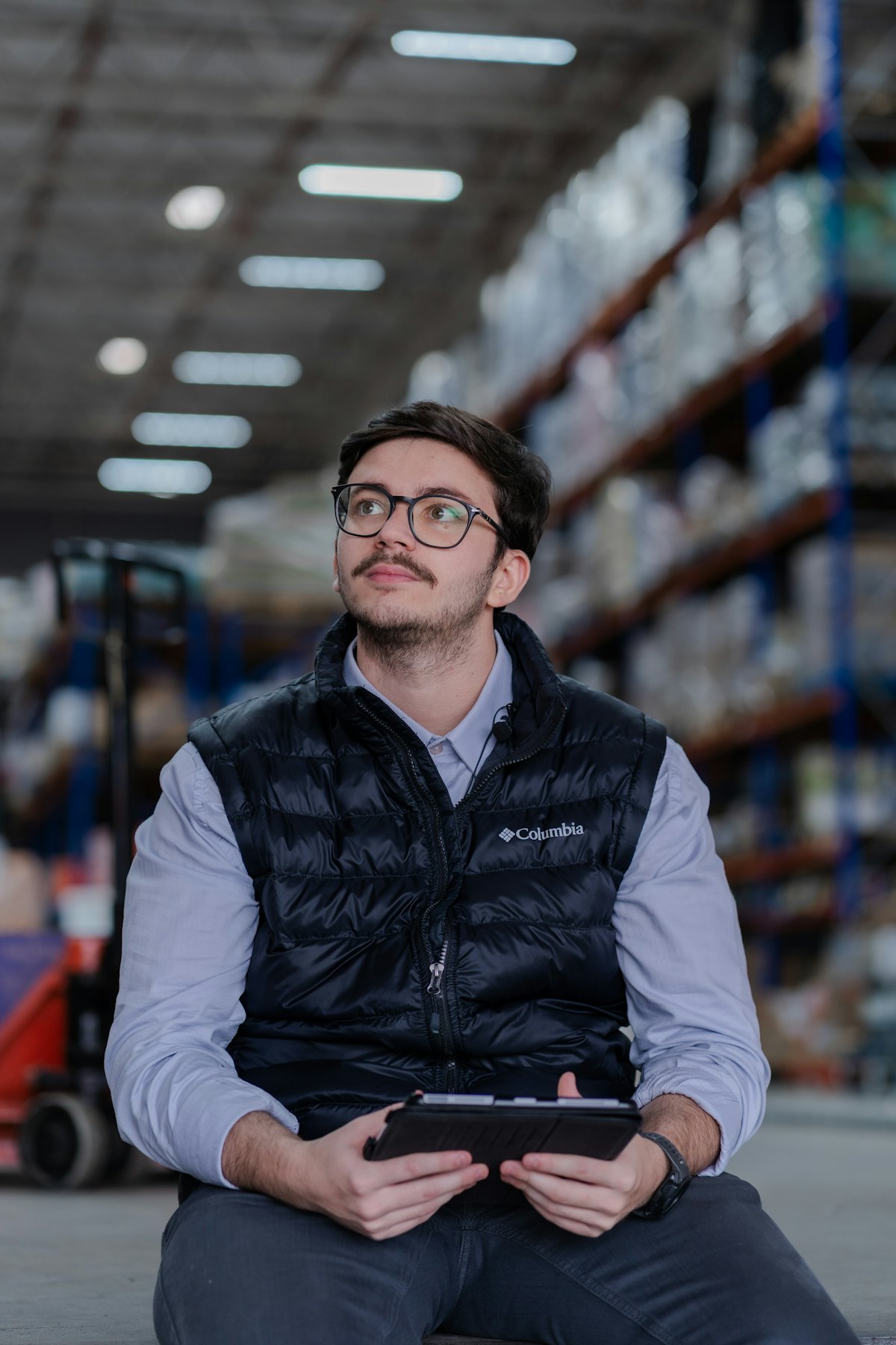 Warehouse team member checking stock on a tablet