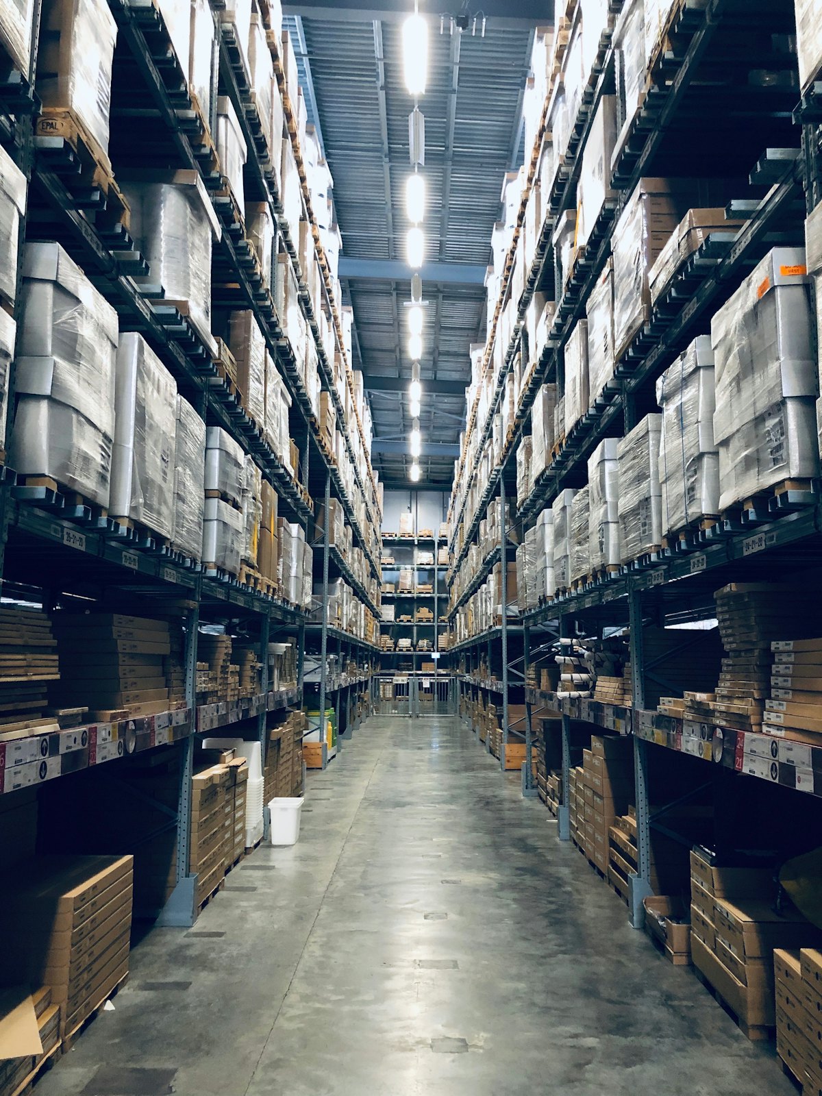 Warehouse aisles stocked with packed goods